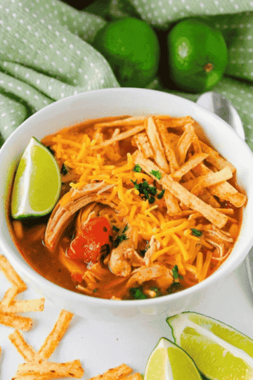This Crock Pot Chicken Enchilada Soup is an easy slow cooker dinner loaded with tender shredded chicken, black beans, corn, fire roasted tomatoes, green chiles and bold enchilada sauce. Perfect for busy weeknights, meal prep, chilly days and family dinners, this Chicken Enchilada Soup Recipe is hearty, flavorful and simple to customize with cheese, sour cream, tortilla strips, cilantro, avocado or lime. If you love Crock Pot Chicken Soup Recipes, Mexican Soup Recipes, Slow Cooker Chicken Enchilada Soup, Easy Crockpot Dinners and cozy comfort food with a Tex-Mex twist, this dump and go soup is a must try for your dinner rotation.