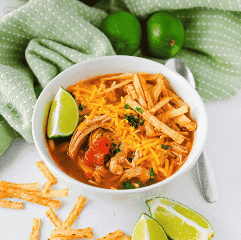 This Crock Pot Chicken Enchilada Soup is an easy slow cooker dinner loaded with tender shredded chicken, black beans, corn, fire roasted tomatoes, green chiles and bold enchilada sauce. Perfect for busy weeknights, meal prep, chilly days and family dinners, this Chicken Enchilada Soup Recipe is hearty, flavorful and simple to customize with cheese, sour cream, tortilla strips, cilantro, avocado or lime. If you love Crock Pot Chicken Soup Recipes, Mexican Soup Recipes, Slow Cooker Chicken Enchilada Soup, Easy Crockpot Dinners and cozy comfort food with a Tex-Mex twist, this dump and go soup is a must try for your dinner rotation.