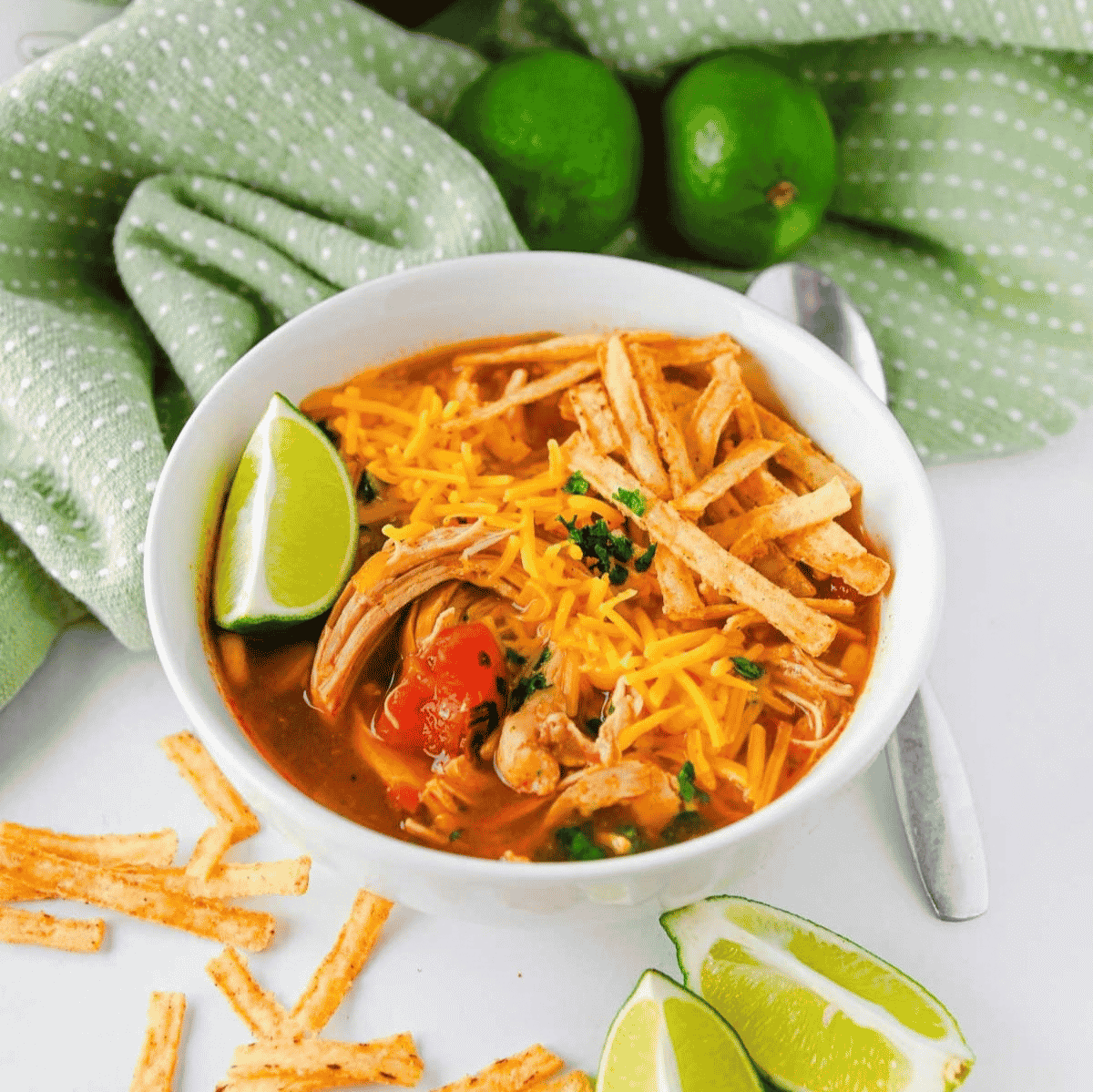 This Crock Pot Chicken Enchilada Soup is an easy slow cooker dinner loaded with tender shredded chicken, black beans, corn, fire roasted tomatoes, green chiles and bold enchilada sauce. Perfect for busy weeknights, meal prep, chilly days and family dinners, this Chicken Enchilada Soup Recipe is hearty, flavorful and simple to customize with cheese, sour cream, tortilla strips, cilantro, avocado or lime. If you love Crock Pot Chicken Soup Recipes, Mexican Soup Recipes, Slow Cooker Chicken Enchilada Soup, Easy Crockpot Dinners and cozy comfort food with a Tex-Mex twist, this dump and go soup is a must try for your dinner rotation.