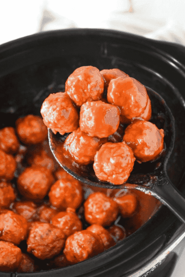 These Crock Pot Cranberry Meatballs are the easy party appetizer your holiday table needs. Frozen homestyle meatballs simmer in a sweet and tangy sauce made with chili sauce, jellied cranberry sauce, brown sugar and Worcestershire for a glossy, saucy bite that is perfect for Christmas appetizers, Thanksgiving party food, game day snacks, potlucks and easy slow cooker recipes. This dump and go crock pot meatballs recipe takes just 5 ingredients and minimal prep, making it a simple appetizer for parties, family gatherings or last minute entertaining. Serve these cranberry meatballs straight from the slow cooker with toothpicks for a warm, crowd pleasing appetizer everyone will keep coming back for.