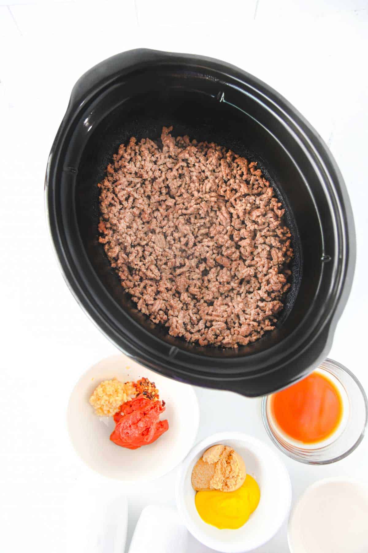 cooked ground beef in a slow cooker