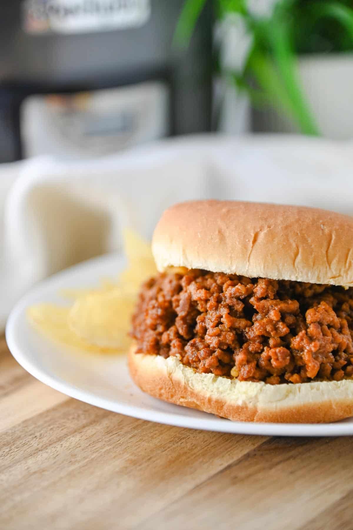 sloppy joe on a plate with chips