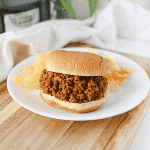 These Crock Pot Sloppy Joes are an easy slow cooker dinner recipe made with ground beef and a sweet, tangy homemade sloppy joe sauce! This easy sloppy joe recipe combines ketchup, brown sugar, mustard, tomato paste, Worcestershire sauce and garlic for a rich, saucy filling the whole family will love. Perfect for busy weeknights, these homemade sloppy joes are a simple family dinner idea with just 10 minutes of prep. Serve the slow cooker sloppy joe meat on hamburger buns with pickles, French fries or potato chips for a classic comfort food meal. If you're looking for easy crockpot ground beef recipes, kid friendly dinner ideas, budget friendly meals or make ahead party food, these Crockpot Sloppy Joes are perfect for weeknight dinners, potlucks and game day!