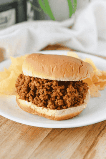 These Crock Pot Sloppy Joes are an easy slow cooker dinner recipe made with ground beef and a sweet, tangy homemade sloppy joe sauce! This easy sloppy joe recipe combines ketchup, brown sugar, mustard, tomato paste, Worcestershire sauce and garlic for a rich, saucy filling the whole family will love. Perfect for busy weeknights, these homemade sloppy joes are a simple family dinner idea with just 10 minutes of prep. Serve the slow cooker sloppy joe meat on hamburger buns with pickles, French fries or potato chips for a classic comfort food meal. If you're looking for easy crockpot ground beef recipes, kid friendly dinner ideas, budget friendly meals or make ahead party food, these Crockpot Sloppy Joes are perfect for weeknight dinners, potlucks and game day!
