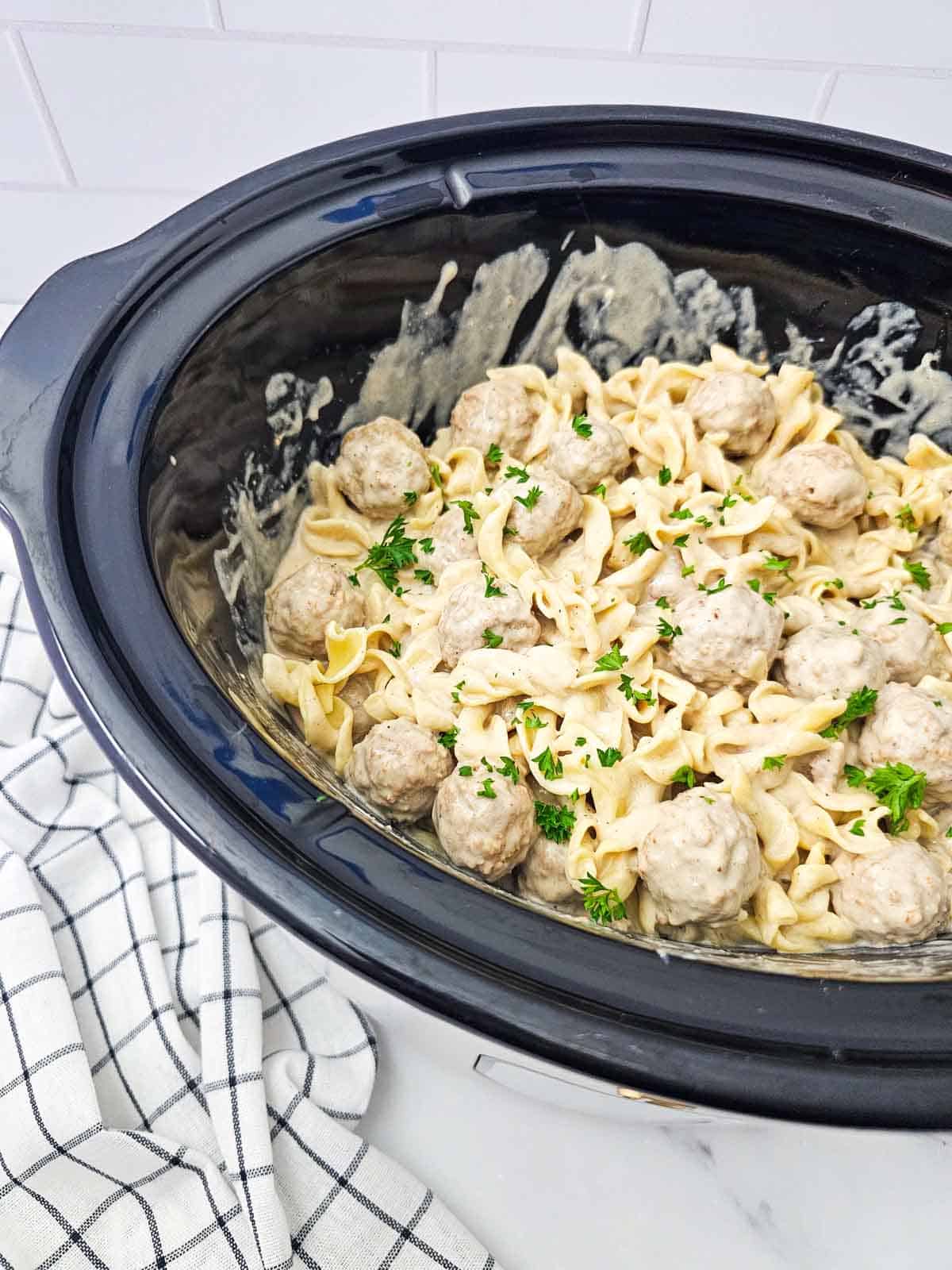 creamy meatballs and egg noodles in a crock pot