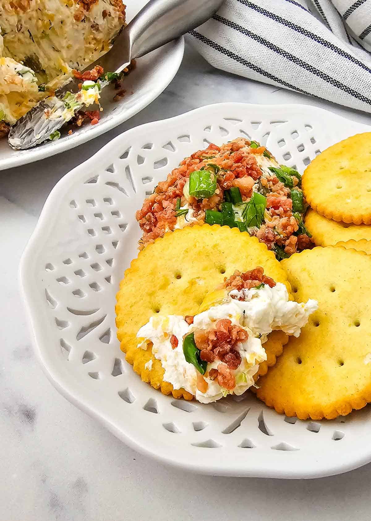 Ritz crackers dipped in cream cheese dill pickle mixture