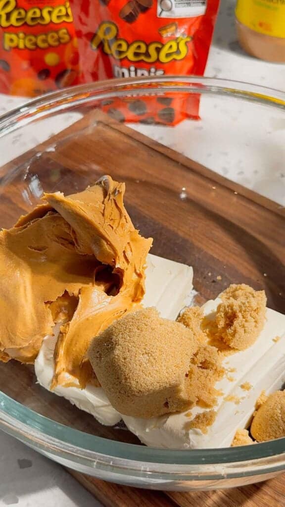 peanut butter, cream cheese and brown sugar in a glass mixing bowl