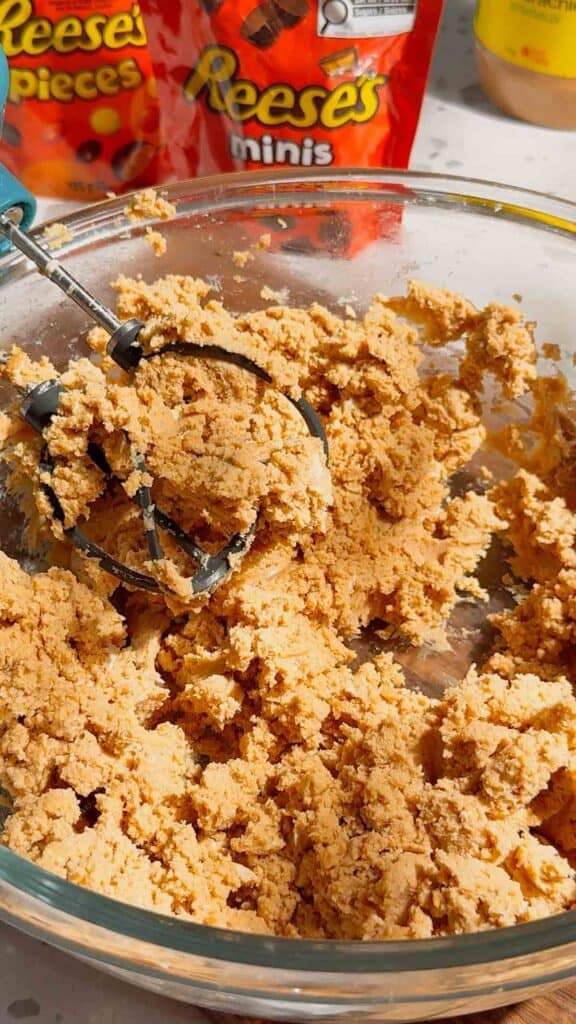 peanut butter, cream cheese and brown sugar creamed together in a mixing bowl