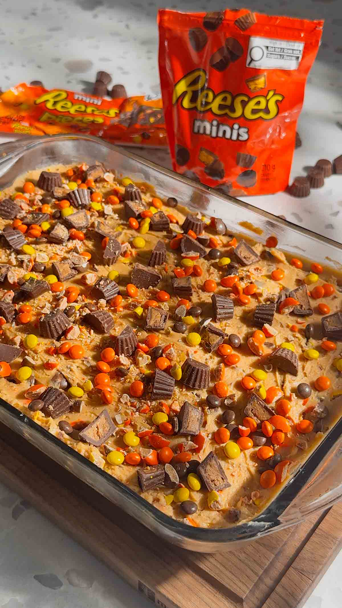 loaded peanut butter cup cheesecake in a 9 x 13 inch dish