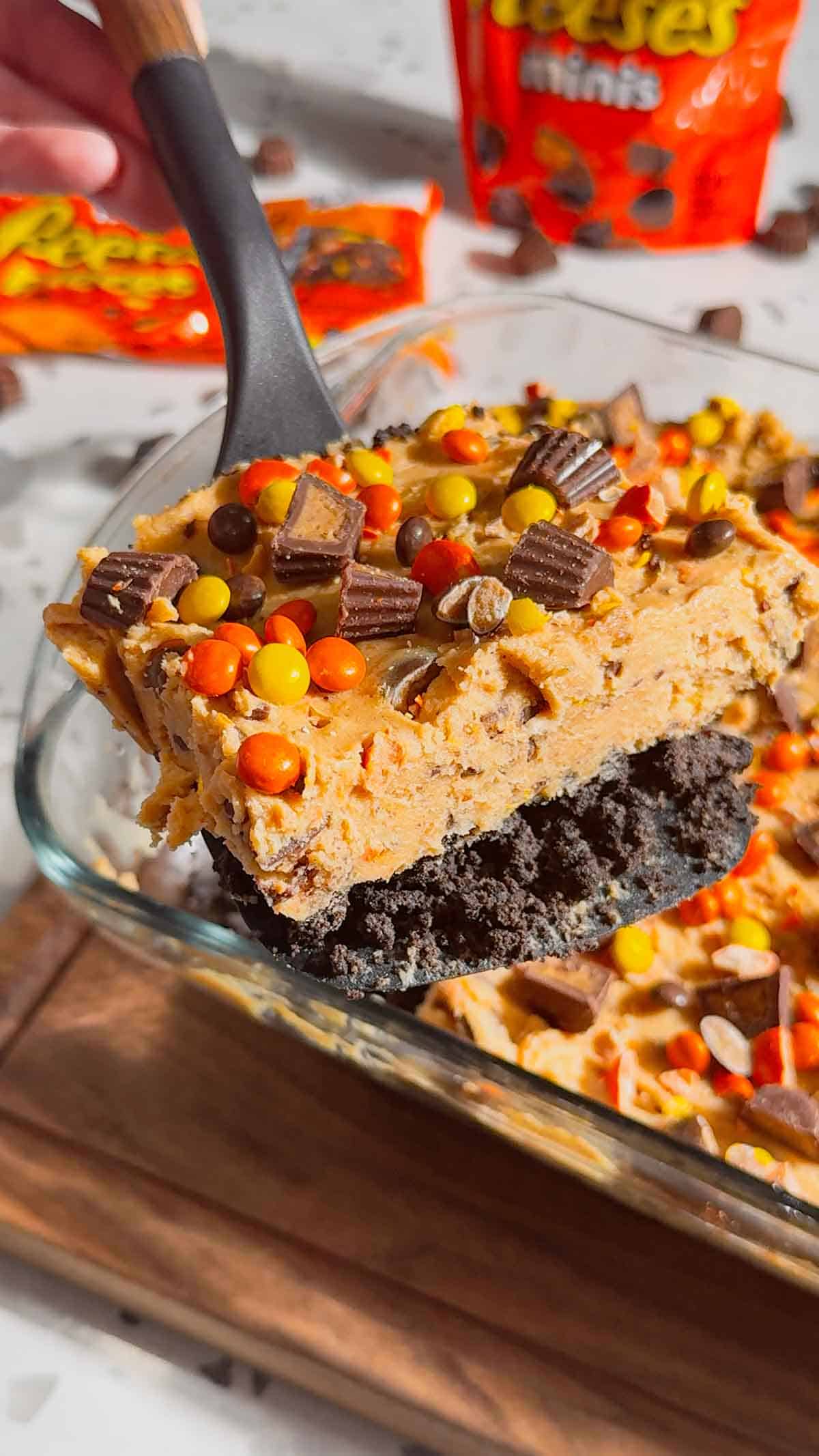 piece of loaded reese's cheesecake on lifting spatula