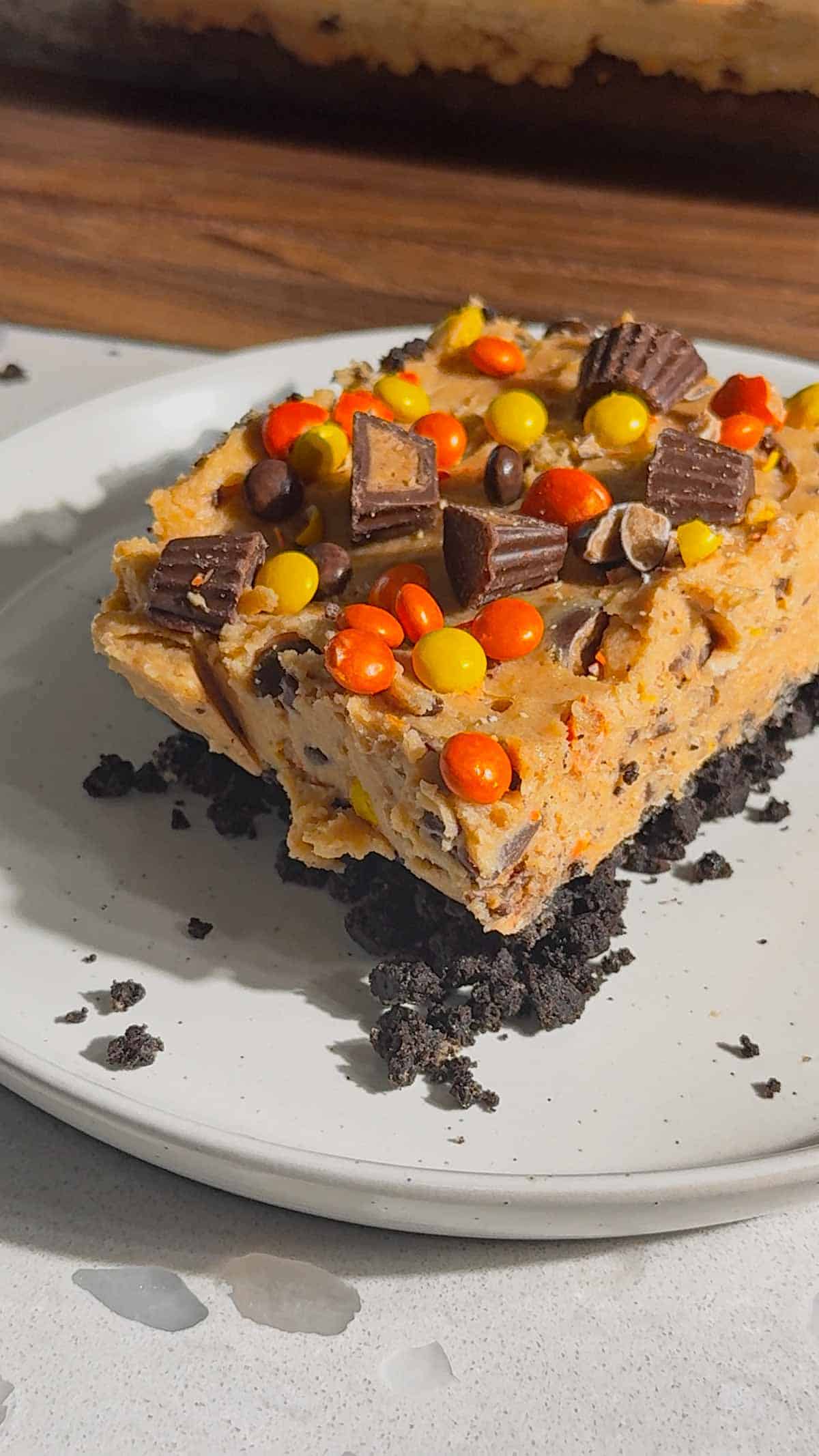 pieces of reese's peanut butter oreo cheesecake on a plate