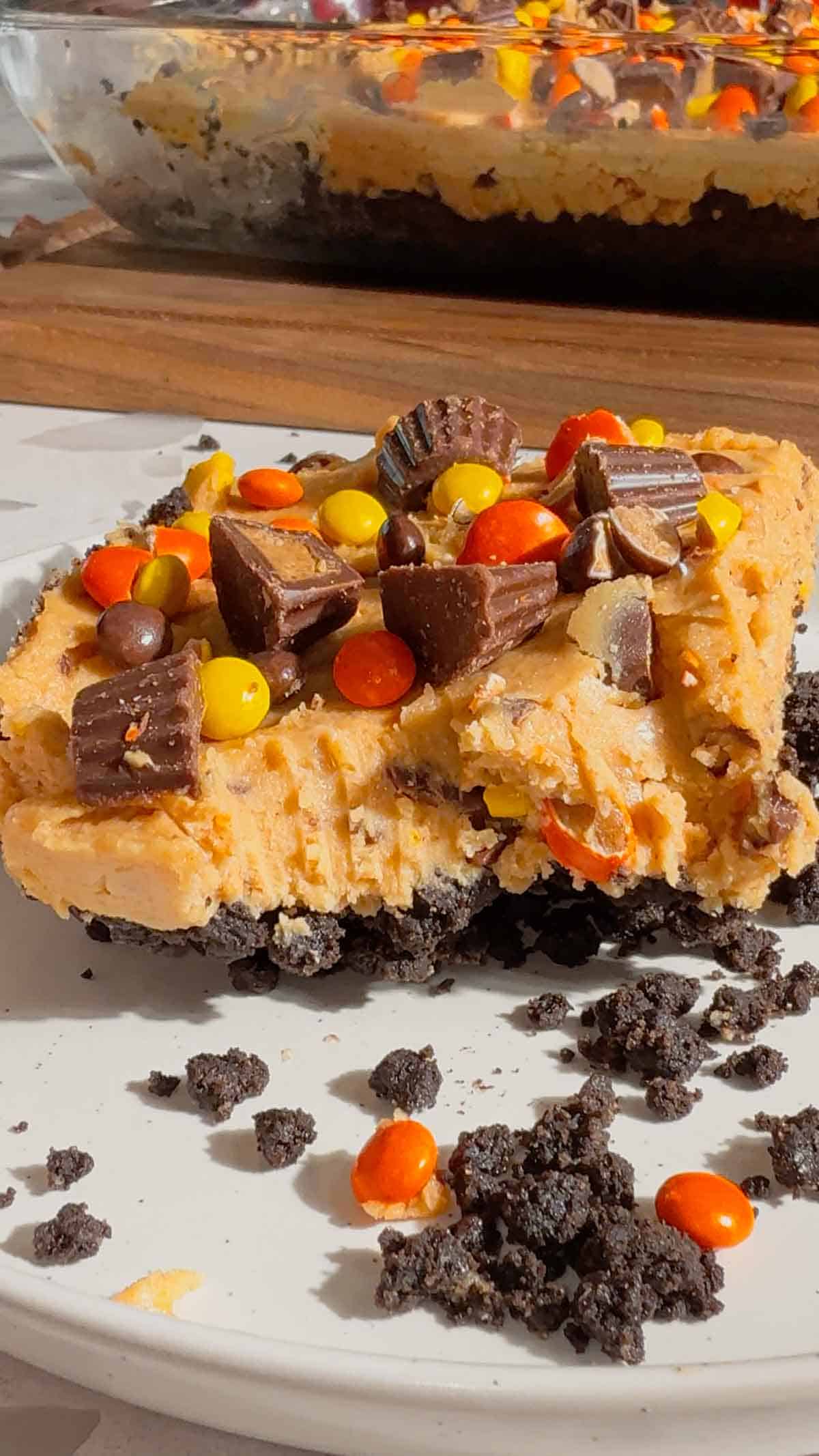 half eaten piece of peanut butter cheesecake on a plate