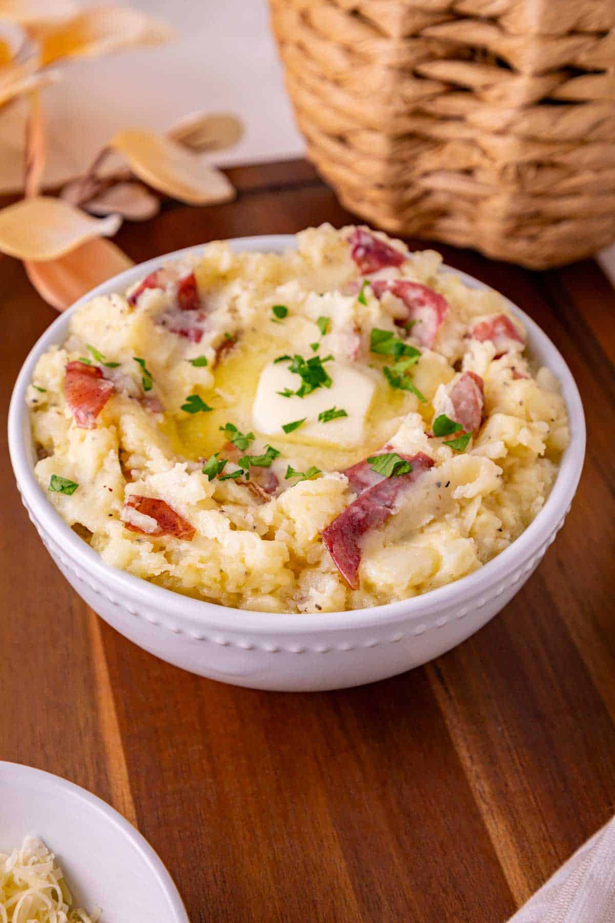butter and parsley on top of red skin garlic mashed potatoes