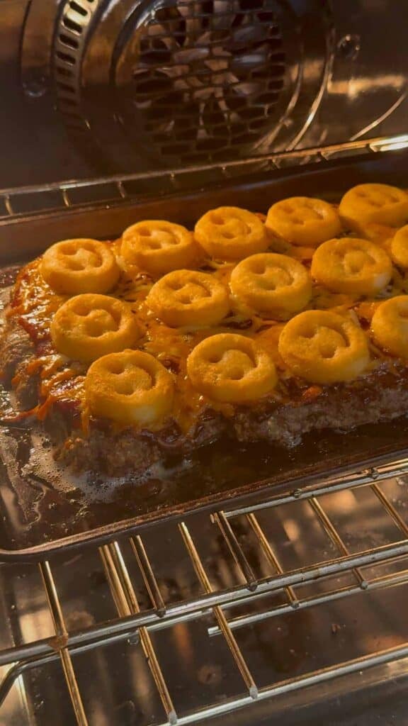 sheet pan meatloaf baking in the oven