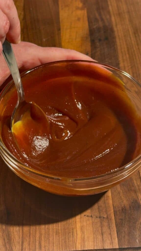 stirring bbq sauce mixture in a bowl