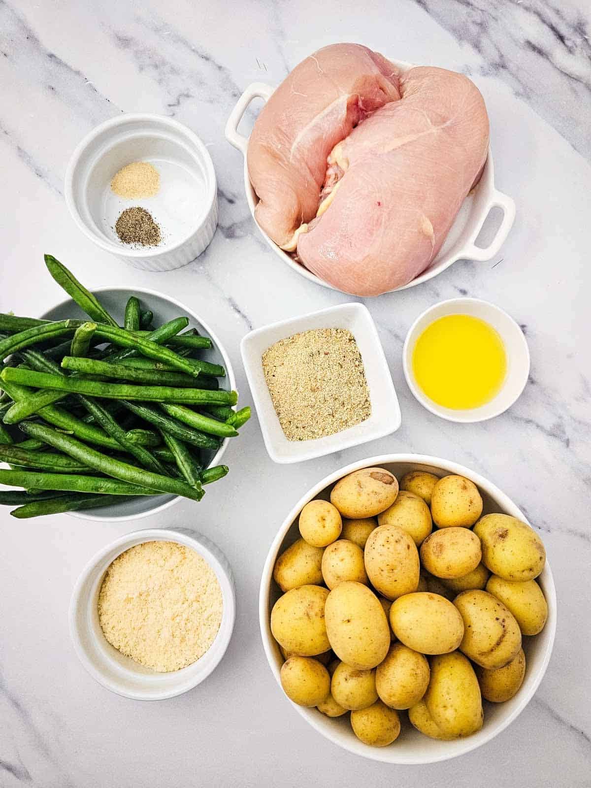 sheet pan parmesan crusted chicken ingredients on the kitchen counter