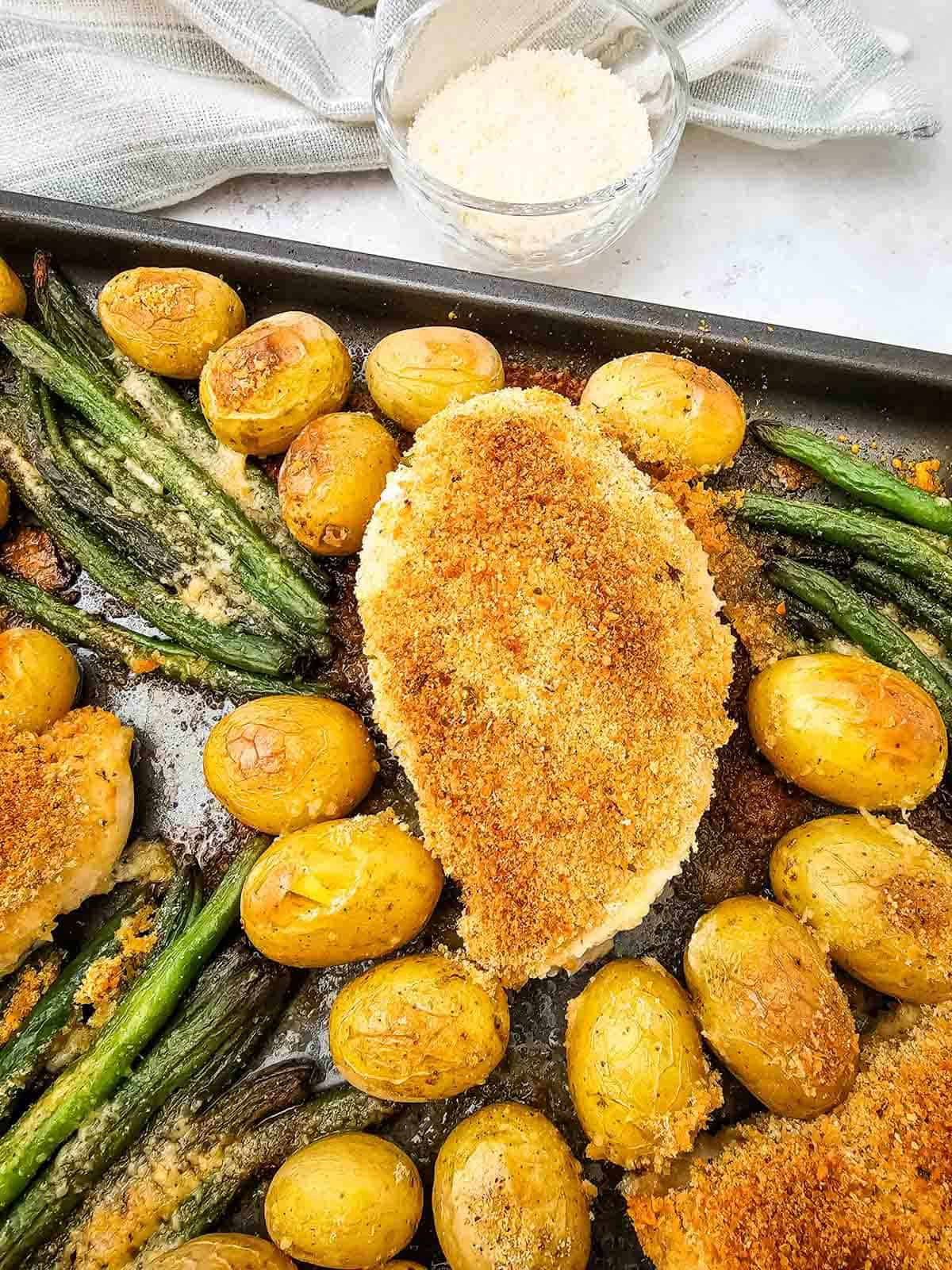 baked parmesan chicken on a sheet pan