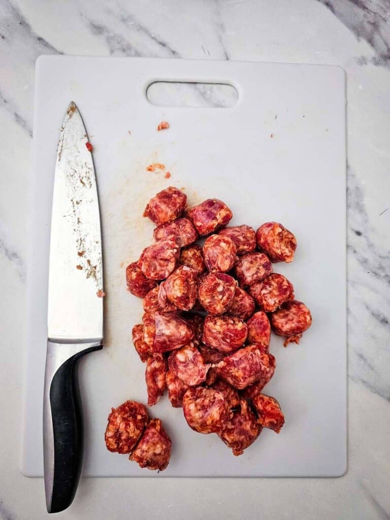 sliced sausage on a cutting board