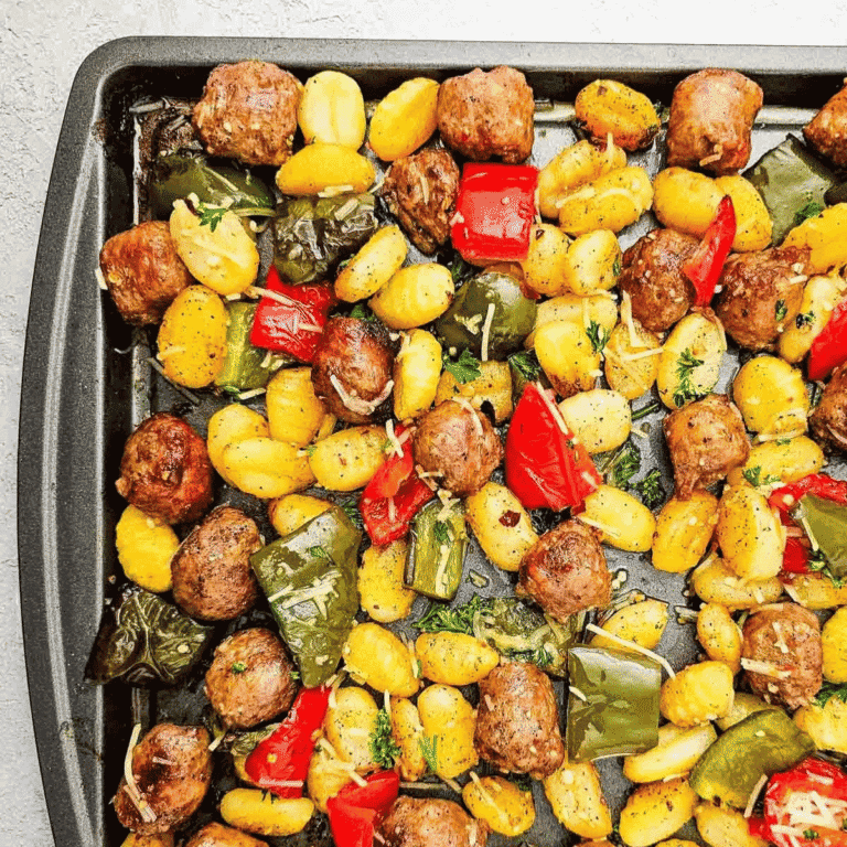 This Sheet Pan Sausage and Gnocchi recipe is an easy weeknight dinner made with Italian sausage, tender gnocchi, bell peppers, garlic, parmesan and simple seasonings all roasted together on one pan. If you need quick dinner ideas, sheet pan dinners, sausage recipes, gnocchi recipes, easy family meals or simple one pan meals, this hearty recipe is perfect. The gnocchi cooks up soft with lightly crisp edges while the sausage and peppers add tons of savory flavor. Great for busy nights, meal planning, comfort food dinners or when you want something filling without a sink full of dishes. Save this easy sheet pan sausage gnocchi dinner for a quick 30 minute meal everyone will love.