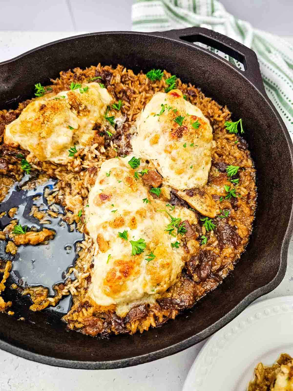 chicken breasts and rice cooked in a skillet