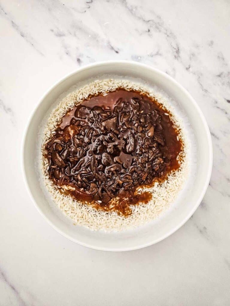 rice and french onion soup in a mixing bowl