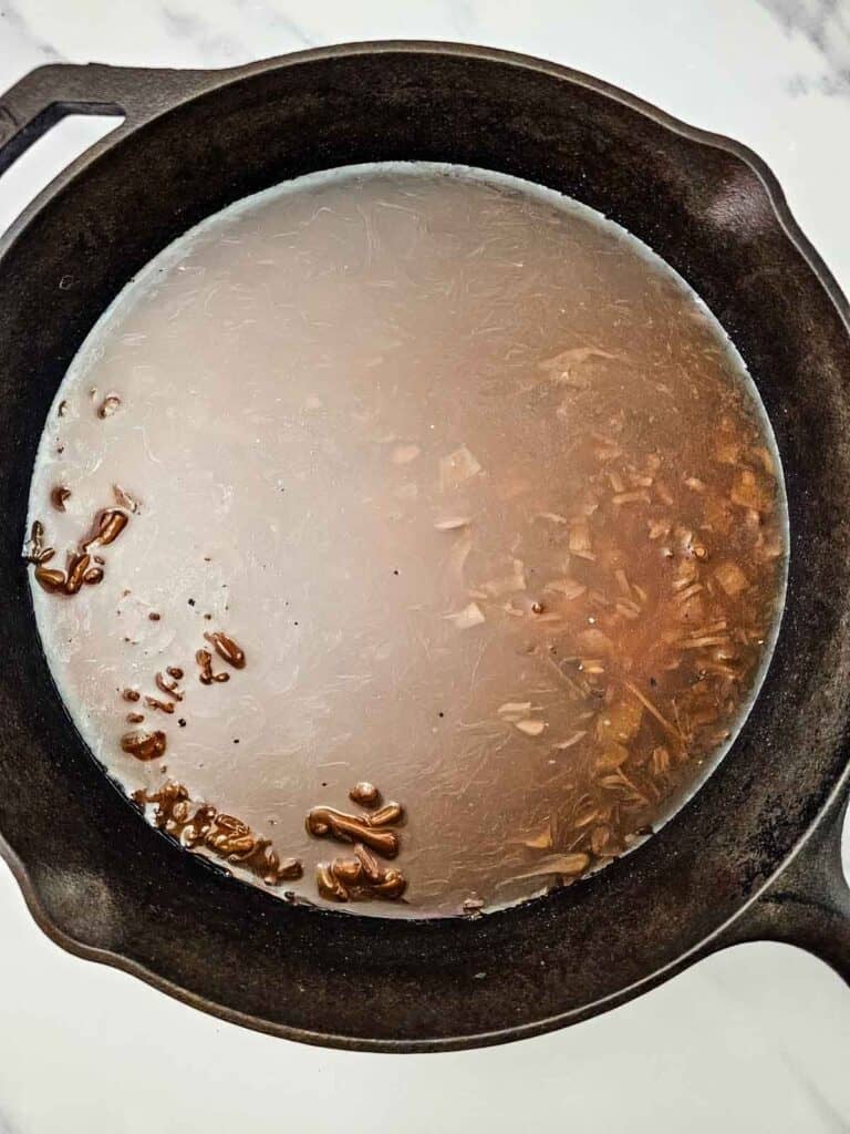 french onion soup, beef consomme and rice in a skillet