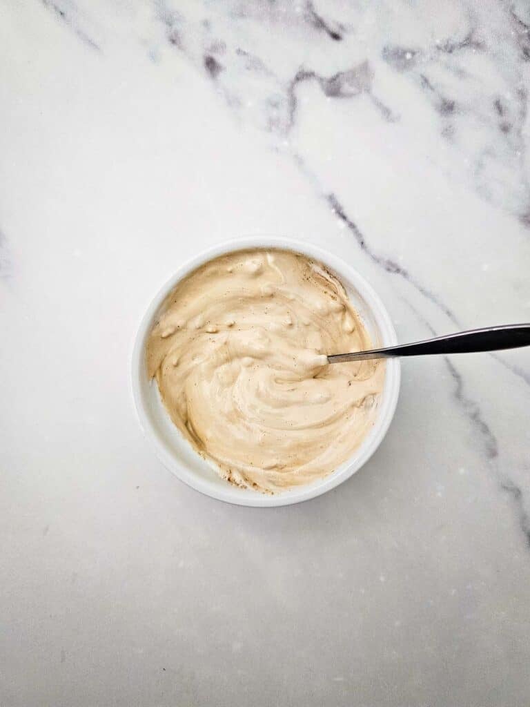 onion soup mix and sour cream stirred together in a bowl