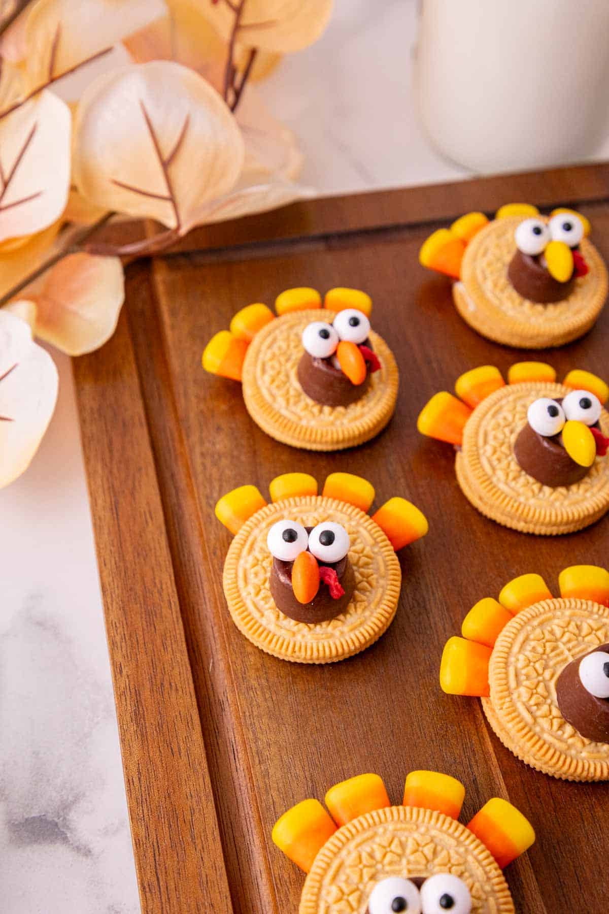 golden oreo turkey cookies on a serving board
