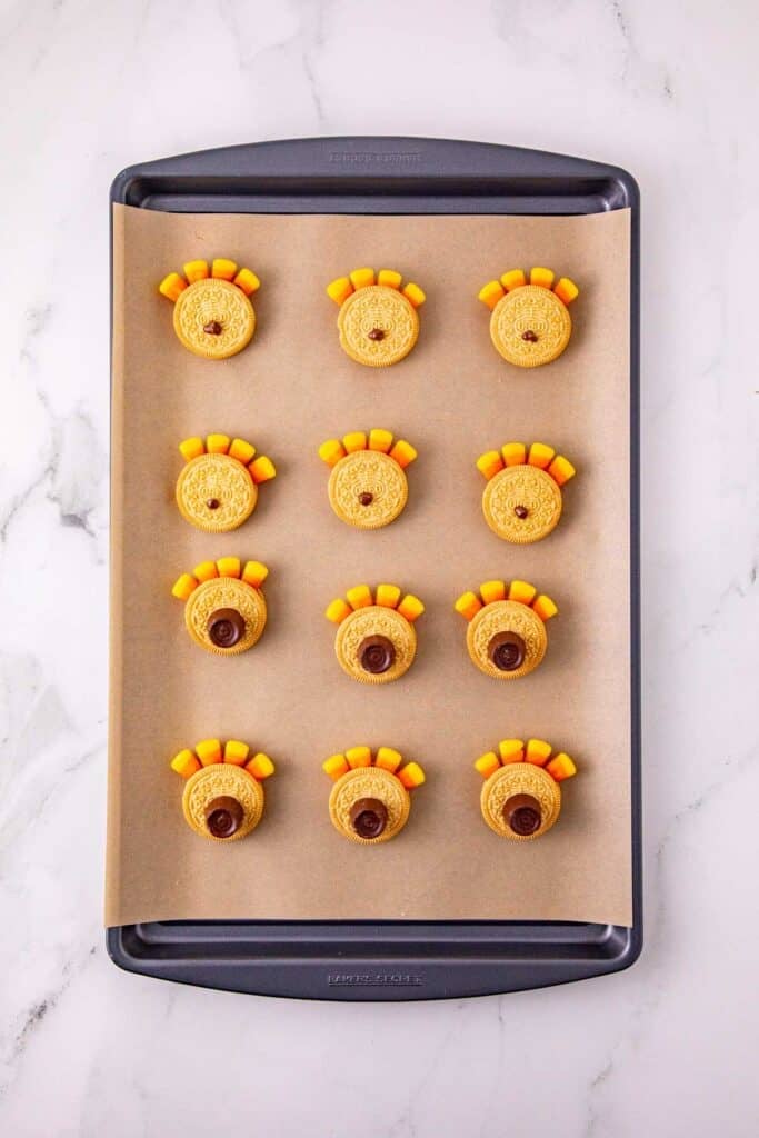 rolos on top of golden oreos on a parchment liined baking sheet