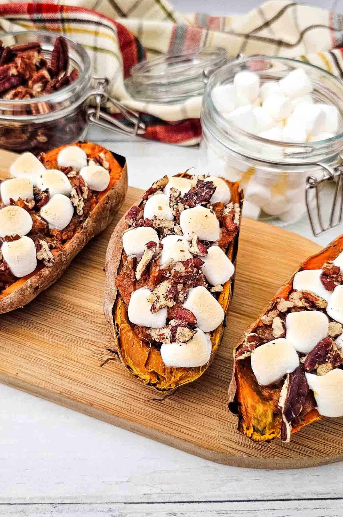 festive twice baked sweet potatoes on a wooden board