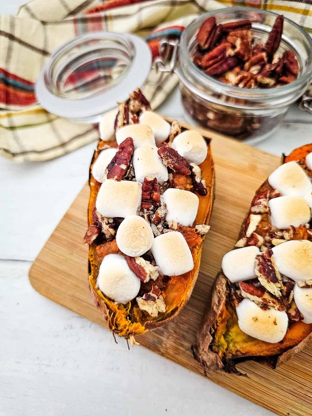 twice baked sweet potatoes with marshmallows and pecans on top
