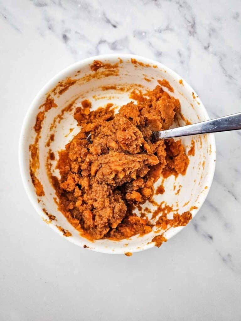 spiced mashed sweet potato mixture in a mixing bowl