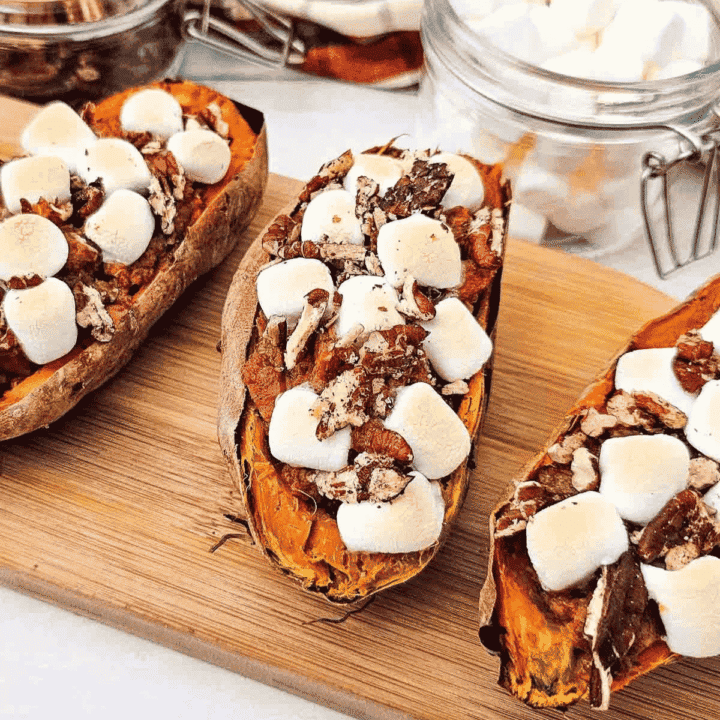 These Twice Baked Sweet Potatoes are an easy holiday side dish made with tender baked sweet potatoes, creamy cinnamon vanilla filling, mini marshmallows, and crunchy pecans. This simple sweet potato recipe is perfect for Thanksgiving dinner, Christmas dinner, fall meals, Easter sides, or cozy family dinners when you want something sweet, warm, and comforting. If you love sweet potato casserole, candied sweet potatoes, marshmallow sweet potatoes, or classic holiday side dishes, this individual twice baked version is a fun and delicious option. Serve these baked sweet potatoes with turkey, ham, chicken, pork chops, or your favorite comfort food dinner for a crowd pleasing side dish everyone will want again.