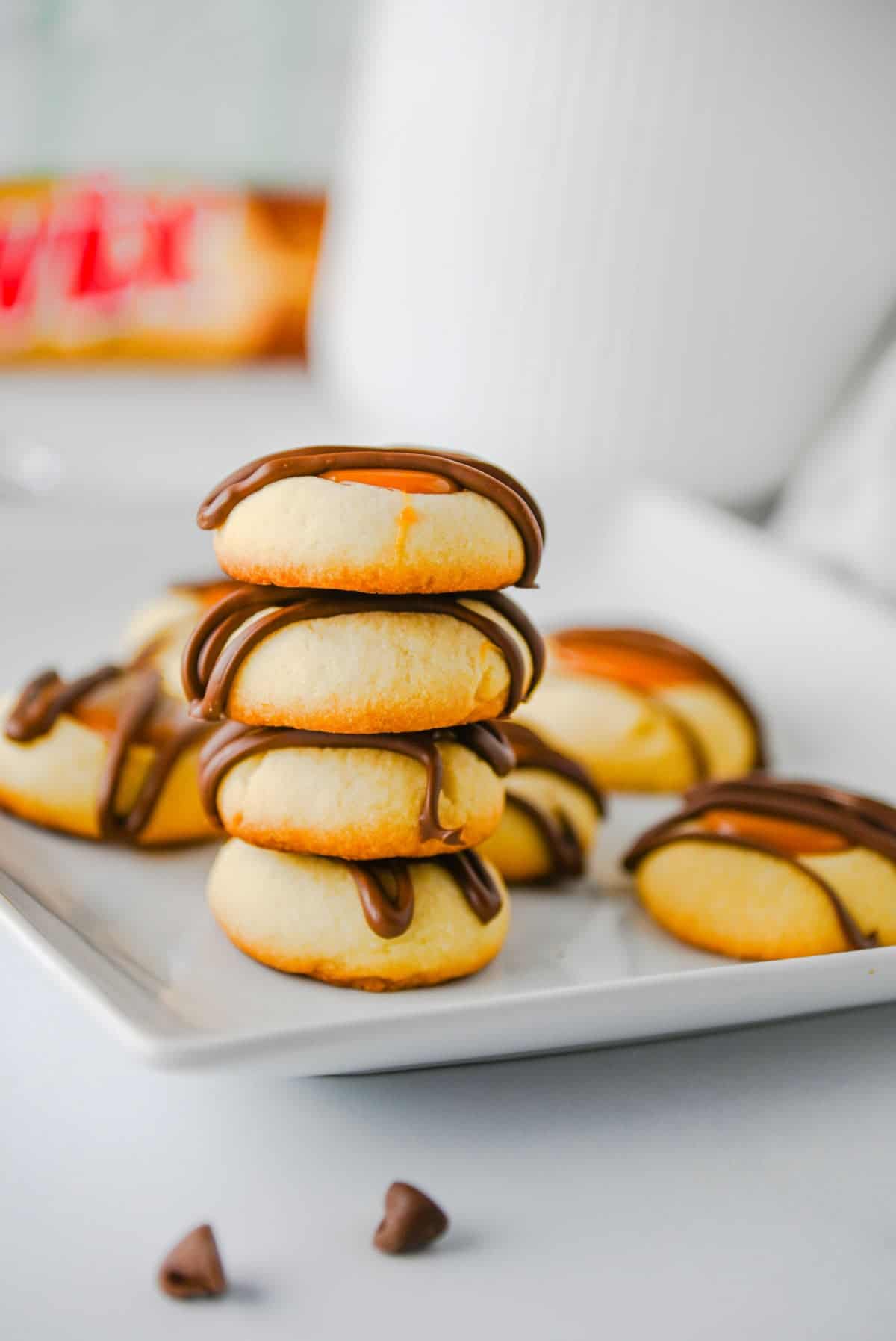 stacked thumbprint cookies on a plate