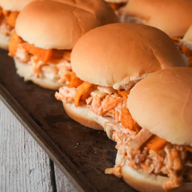 BBQ Fritos Chicken Sandwiches are an easy dinner recipe using shredded chicken and loaded with BBQ corn chips, cheddar cheese and bacon. This recipe is perfect for summer because if you use a grocery store rotisserie chicken you won't even have to turn on the oven.