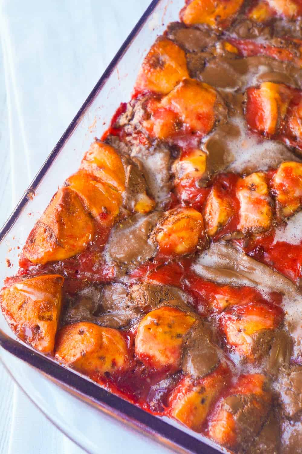 Strawberry Nutella Cinnamon Bun Casserole is an easy breakfast or brunch dish using Pillsbury Cinnamon Rolls. This breakfast casserole loaded with strawberry pie filling and chocolate hazelnut spread is a fun alternative to French toast.