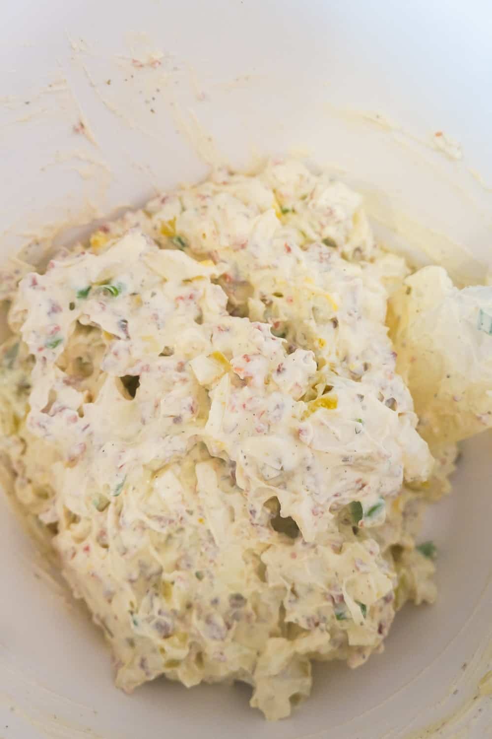 bacon and onion cream cheese dip in mixing bowl