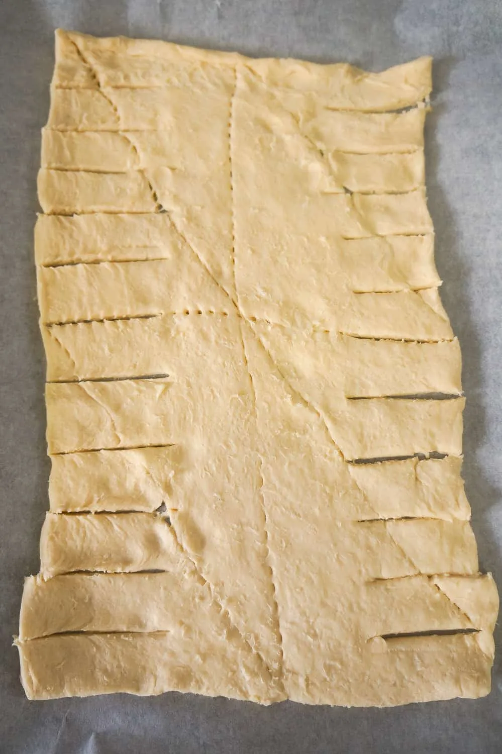 crescent dough with strips cut