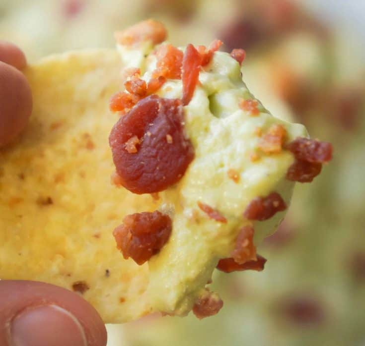 Bacon Cream Cheese Avocado Dip is the perfect party chip dip recipe. If you like guacamole but are looking for something a little richer you will love this avocado dip loaded with cream cheese and real bacon bits.