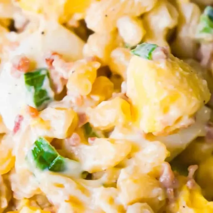 Bacon Egg Pasta Salad is a delicious cold side dish recipe. This pasta salad loaded with real bacon bits and hard boiled eggs is perfect for potlucks and BBQs.