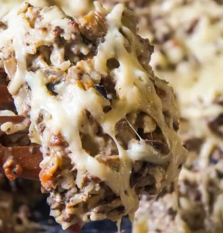 Bacon Mushroom Swiss Ground Beef and Rice is an easy stove top dinner recipe that can be on the table in under 30 minutes. This ground beef dish is loaded with sliced mushrooms, real bacon bits and Swiss cheese.