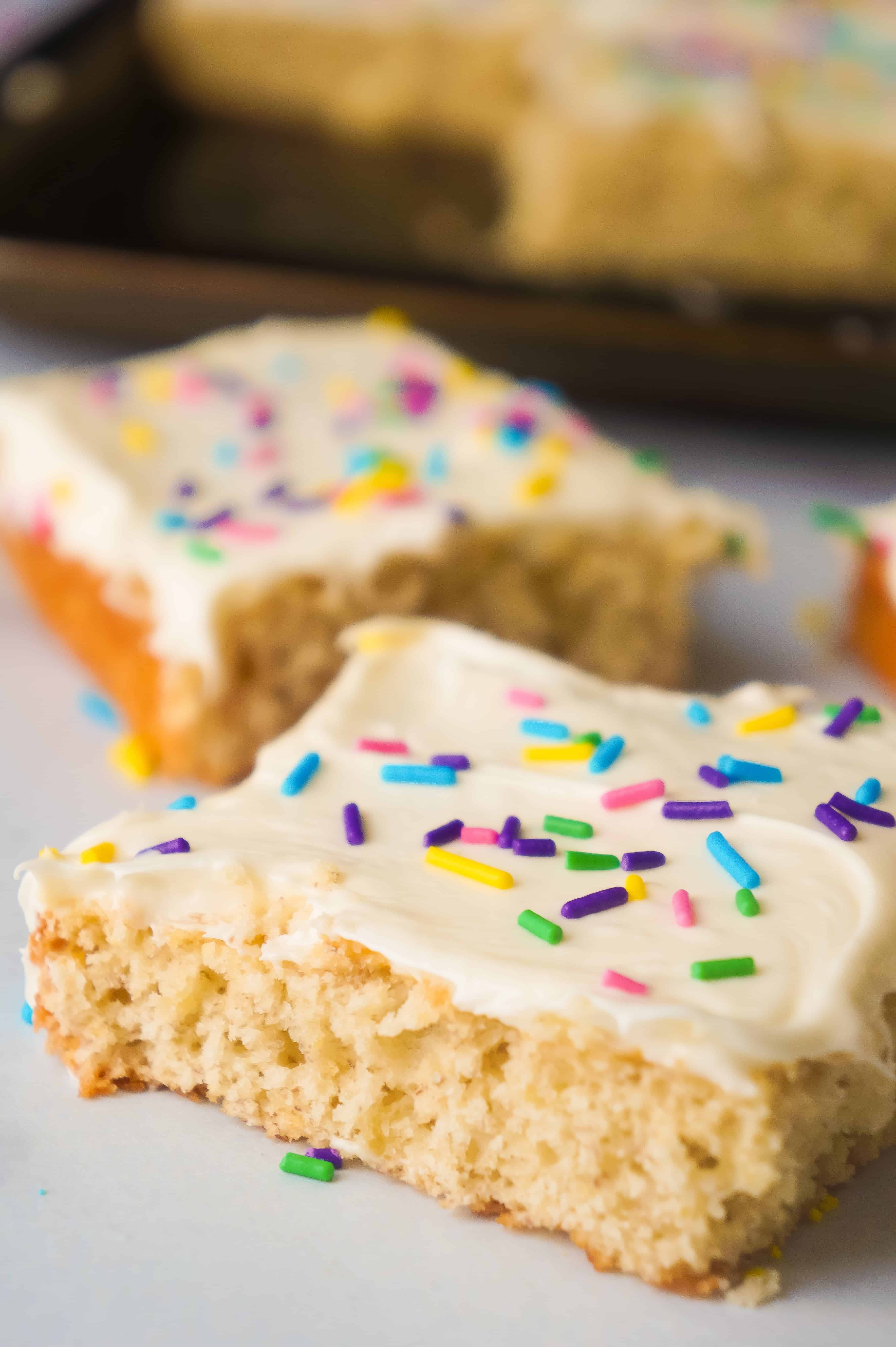 Banana Sugar Cookie Bars are an easy dessert recipe using only five ingredients. Sugar Cookie mix and ripe bananas form the base of these cookie bars which are topped with vanilla icing and colourful sprinkles.