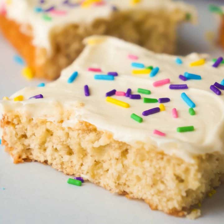 Banana Sugar Cookie Bars are an easy dessert recipe using only five ingredients. Sugar Cookie mix and ripe bananas form the base of these cookie bars which are topped with vanilla icing and colourful sprinkles.