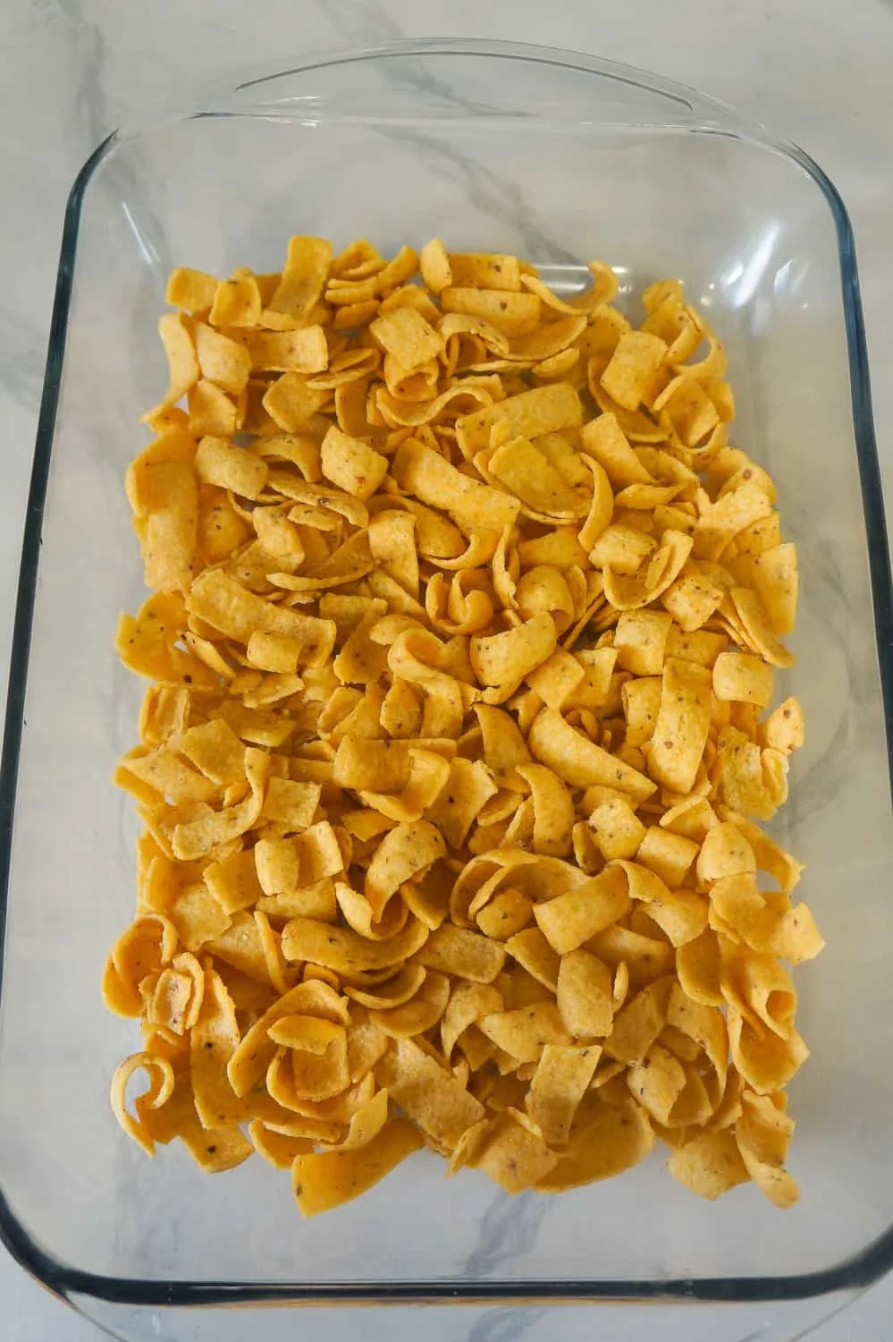 corn chips in the bottom of a baking dish