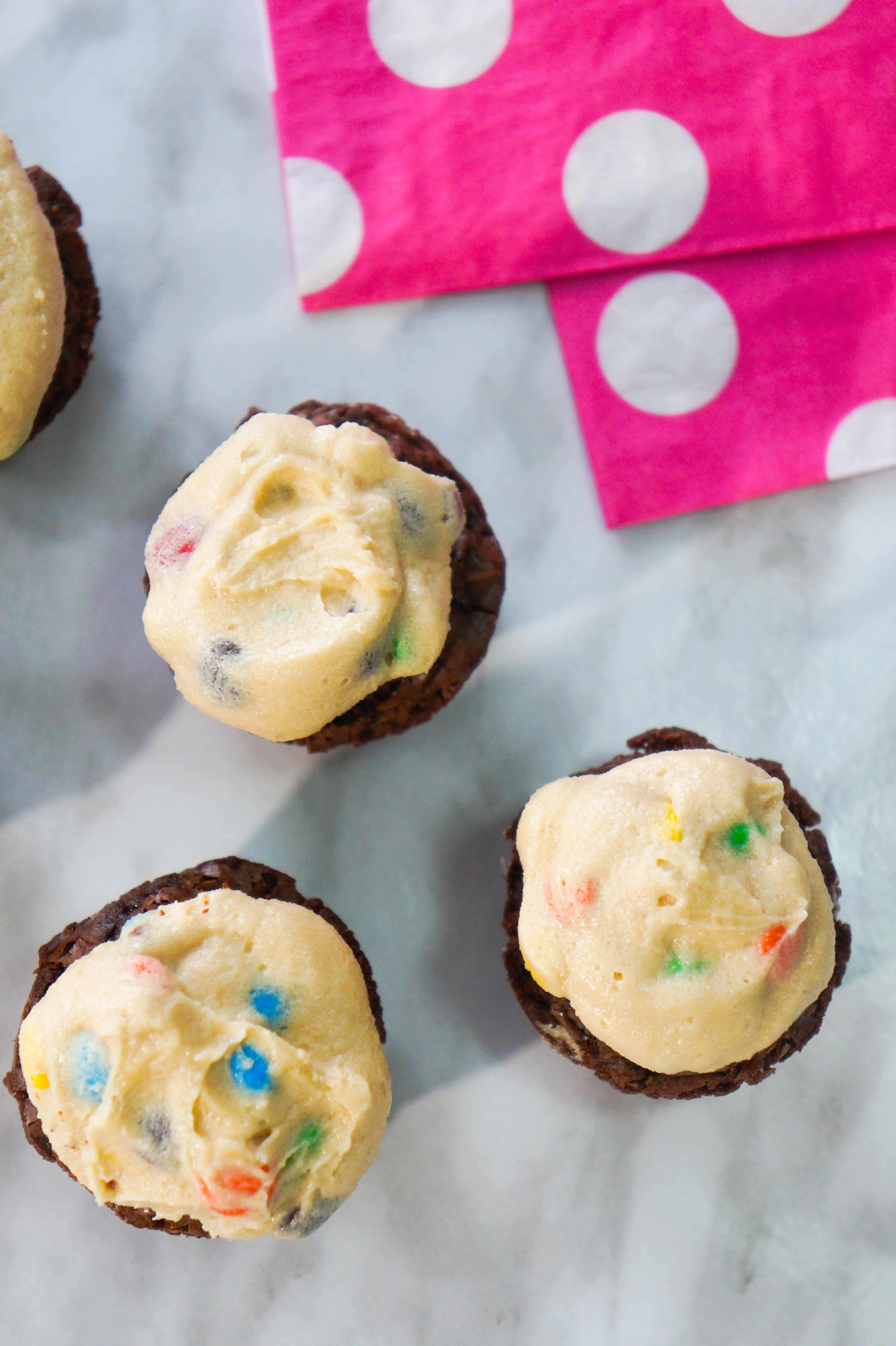 Bite Size Brownies with Cookie Dough Frosting. Easy mini dessert recipe. Mini cookie dough brownies with M&Ms.