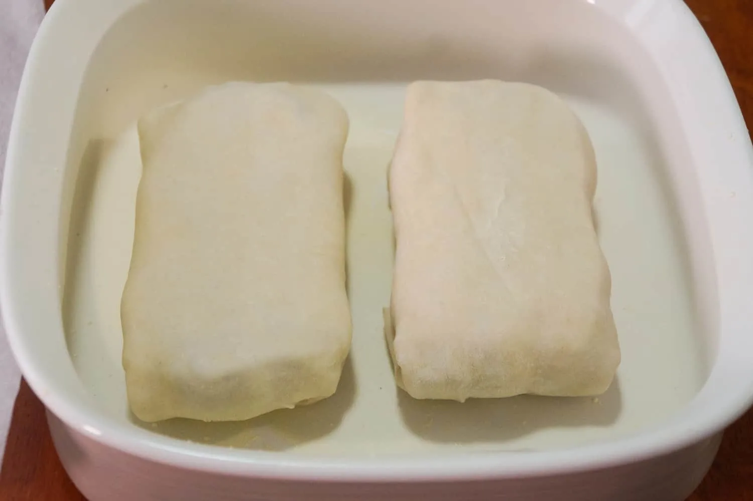 beef wellingtons in baking dish