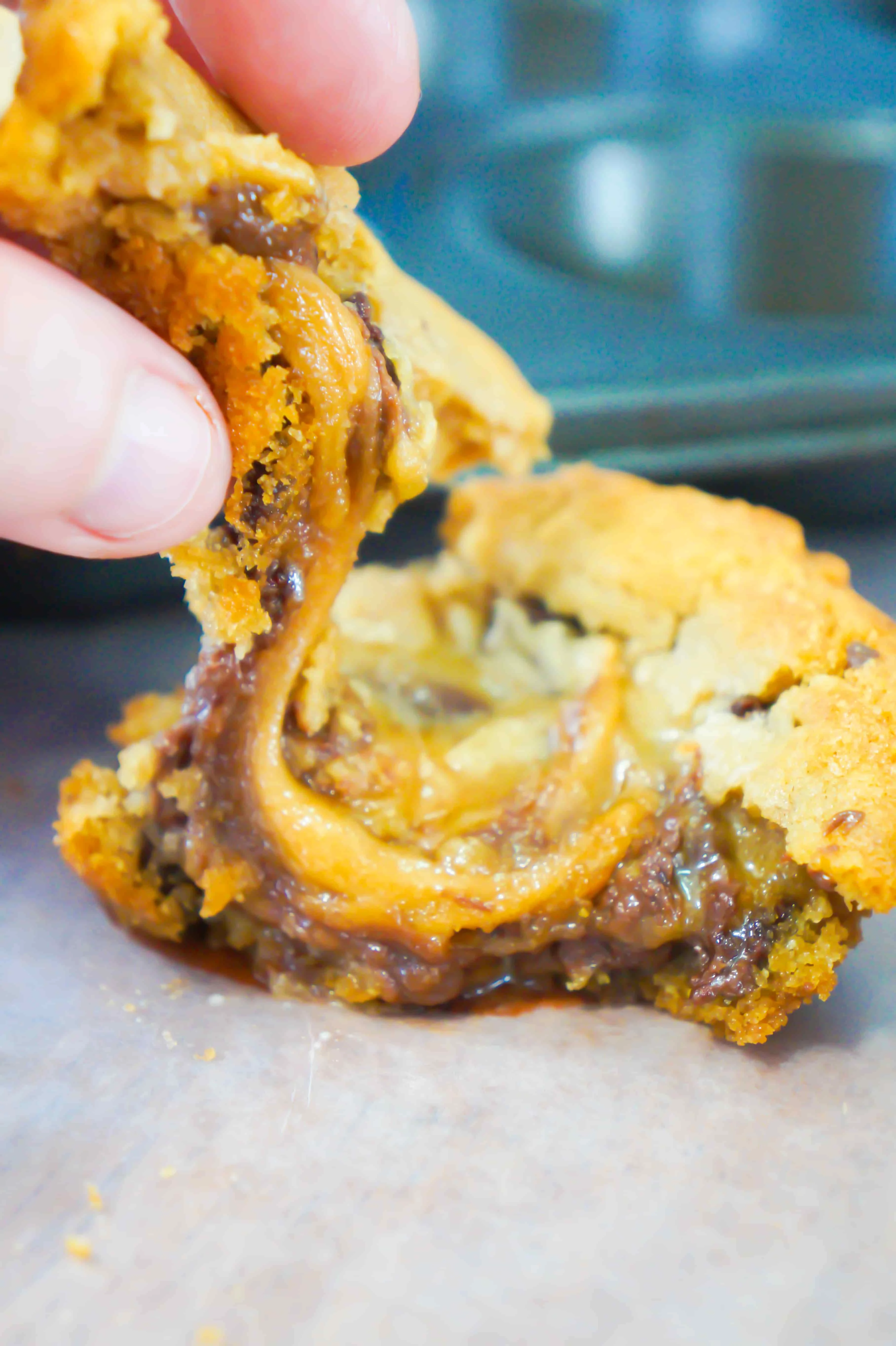 Caramel Chocolate Cream Cheese Stuffed cookies are an easy 3 ingredient dessert recipe using Pillsbury cookie dough. These chocolate chip cookies are filled with chocolate cream cheese and caramel.