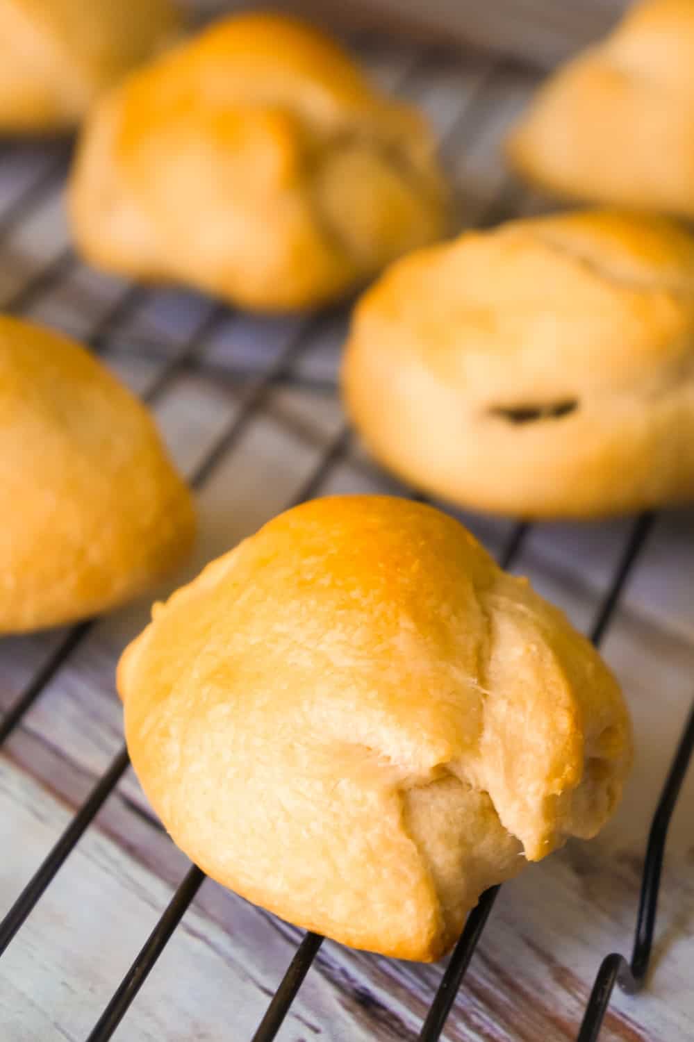 Caramel Peanut Butter Cup Stuffed Crescent Rolls are an easy three ingredient dessert recipe. These Pillsbury crescent rolls are filled with Reese's Peanut Butter Cups and Kraft Caramels.