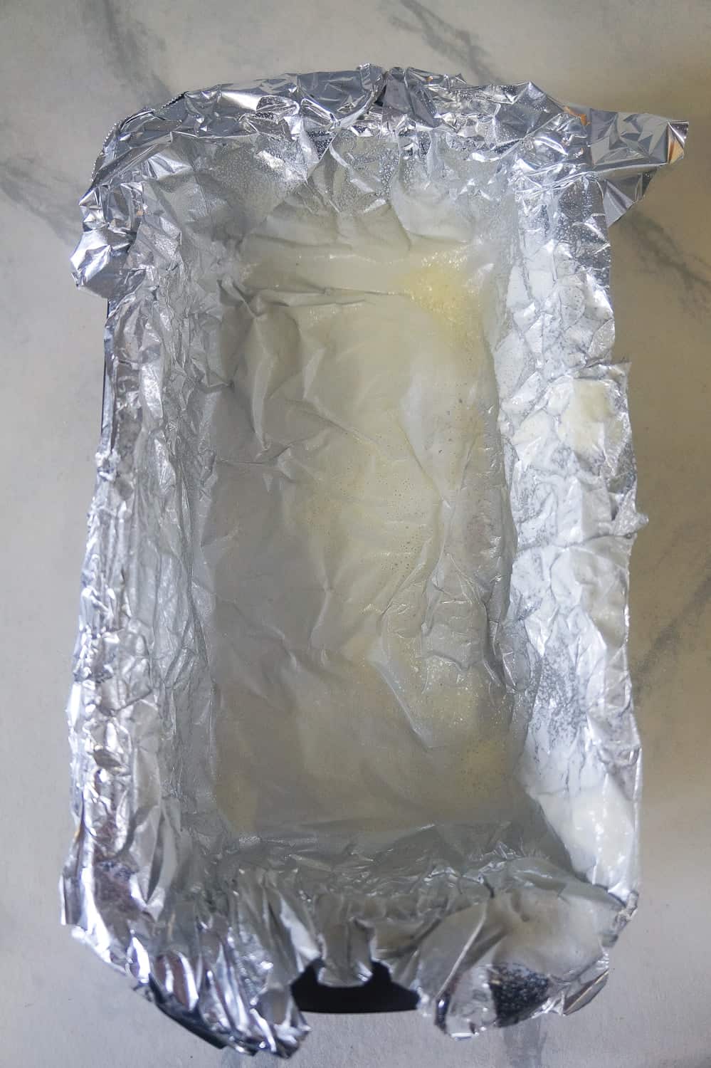 loaf pan lined with aluminum foil