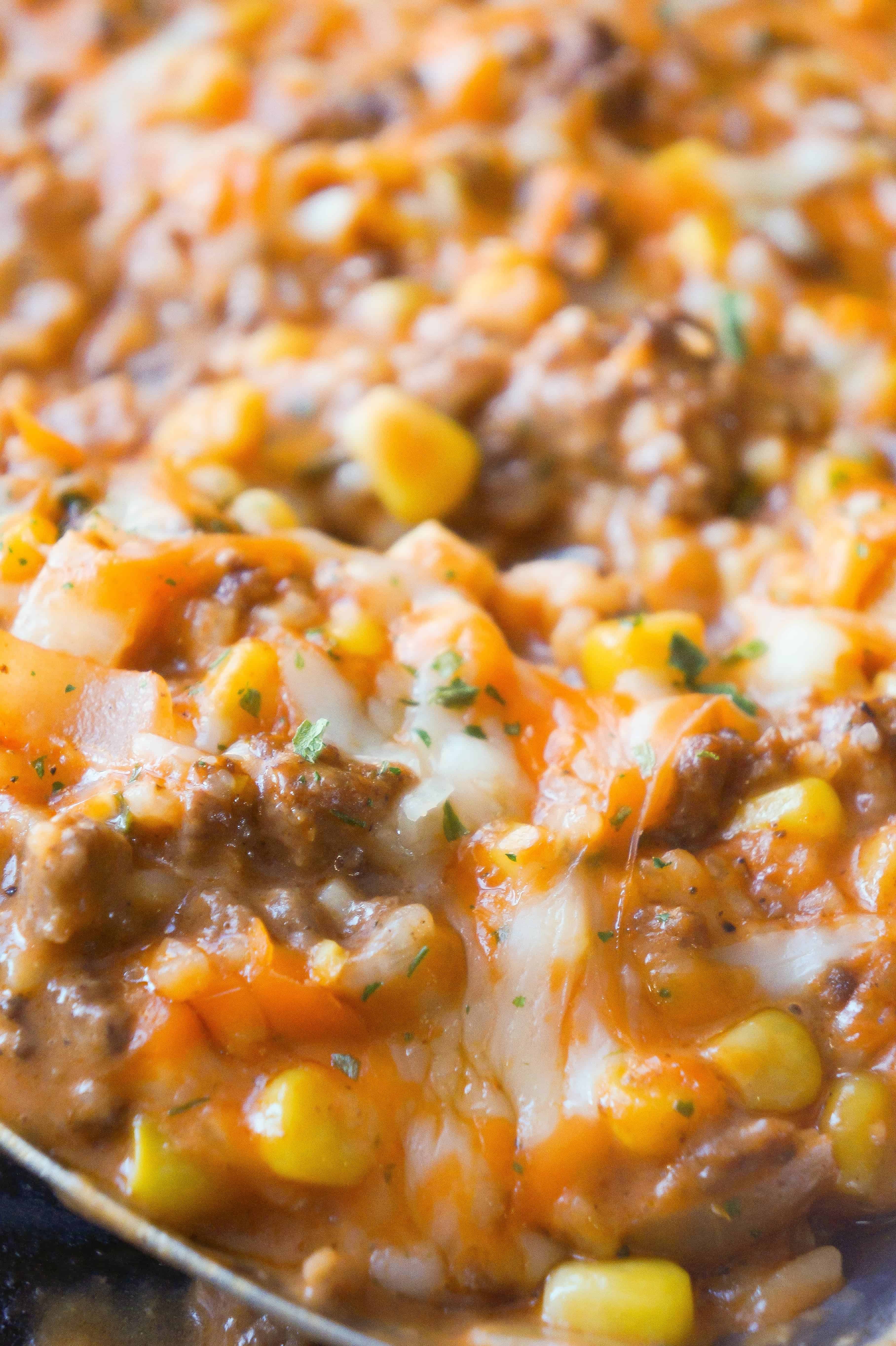 Cheesy Tomato Ground Beef and Rice is an easy stove top dinner recipe packed with flavour. This ground beef dish is made with cream of tomato soup, canned corn, instant rice and loaded with cheddar cheese.